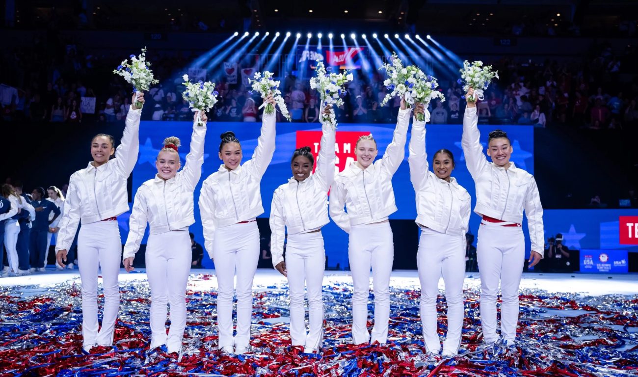 Seven young women in their all white costume.